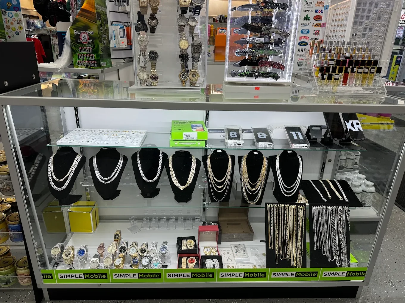 Jewelry and watches display case inside Eagle Smoke & Convenience Shop